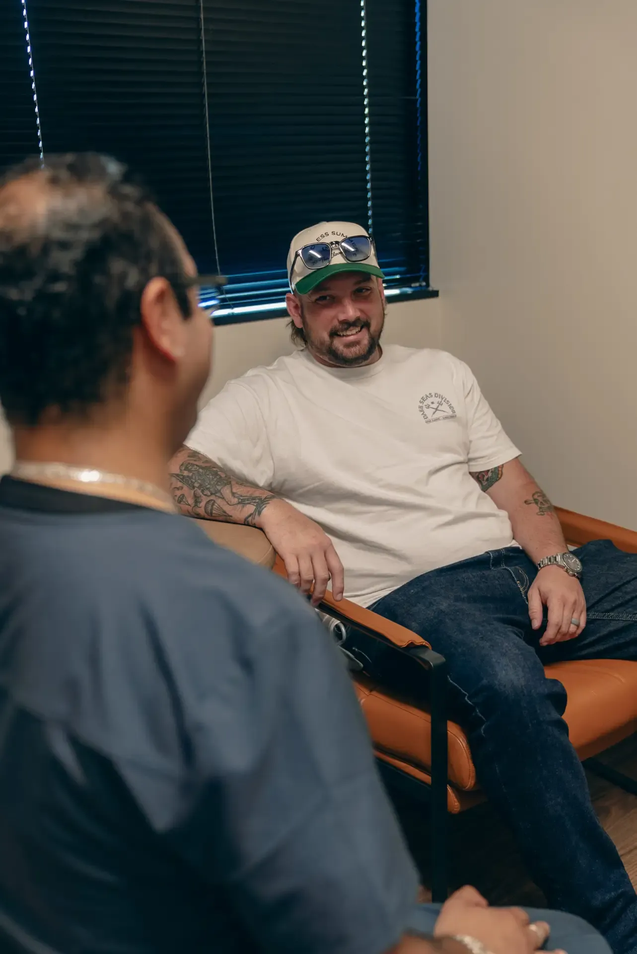 A patient chatting with an Xcel medical assistant in the clinic