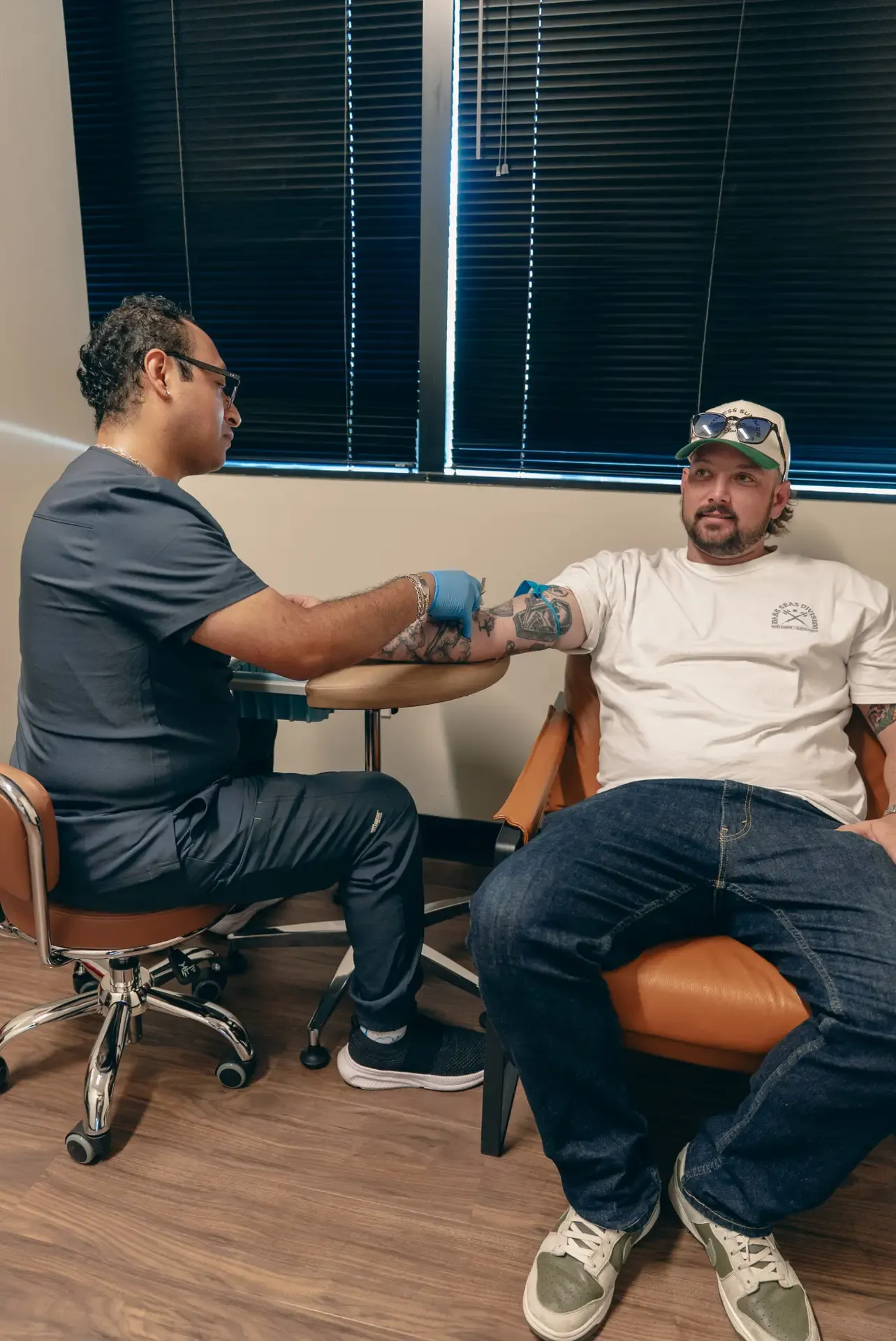 A patient having blood drawn at the Xcel clinic